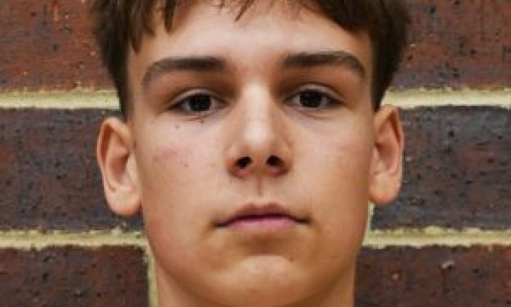 Young man posing for a portrait photograph with a serious expression.