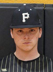 Baseball player wearing a black and white uniform with a baseball cap.