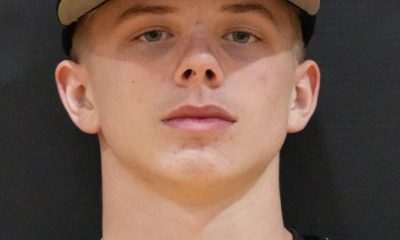 Baseball player in a black and white uniform.