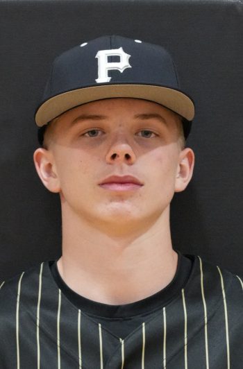 Baseball player in a black and white uniform.