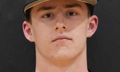 Baseball player in uniform posing for a portrait.