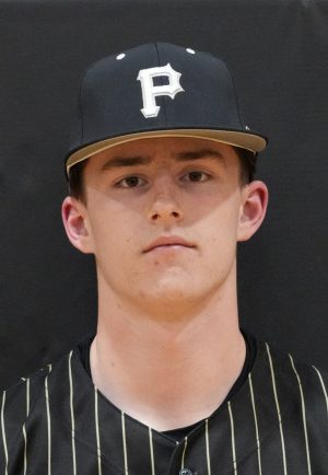 Baseball player in uniform posing for a portrait.