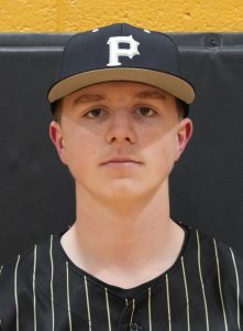 Young male athlete in baseball uniform posing for team portrait.