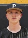 Young male athlete in baseball uniform posing for team portrait.