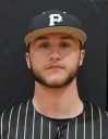 Man in baseball uniform posing for picture.