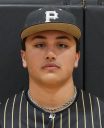 Baseball player posing in uniform, looking directly at the camera.