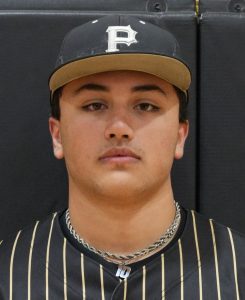 Baseball player posing in uniform, looking directly at the camera.