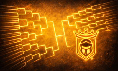 An emblematic shield design on a dark background with an intricate pattern of lines and shapes.