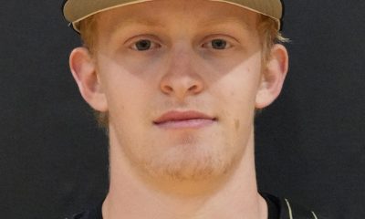 Baseball player posing in a uniform.