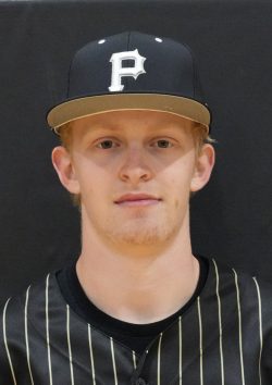 Baseball player posing in a uniform.