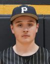 Baseball player in uniform posing for portrait.