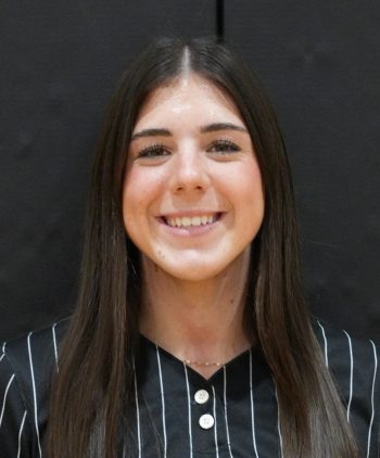 Woman in striped shirt smiling at camera.