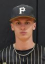 Baseball player in a black and gold uniform posing for a portrait.