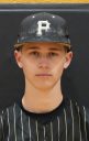 Baseball player in uniform posing for a portrait.