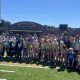 Girls Track Team poses with a trophy.