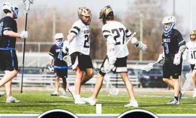 A black and white sports jersey with a score of 15-1 on it.