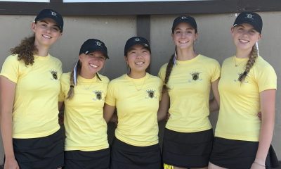 Girls golf team poses for a photo.