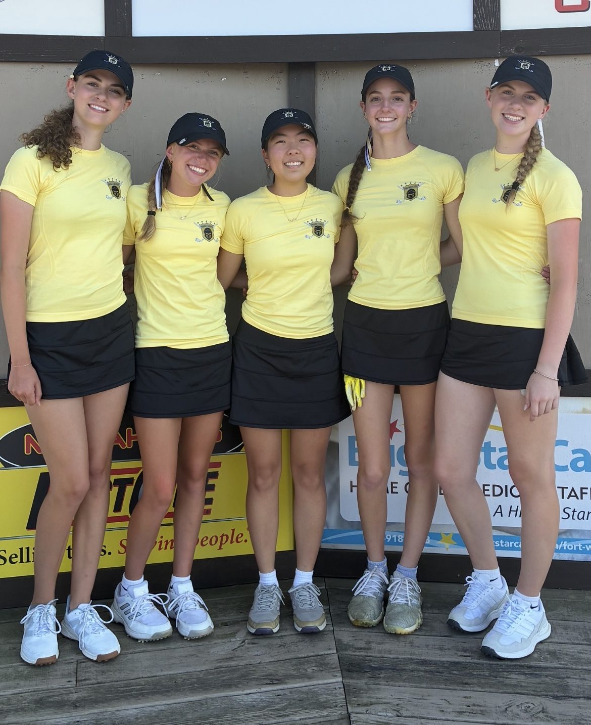 Girls golf team poses for a photo.