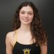Woman in black and yellow swimsuit.